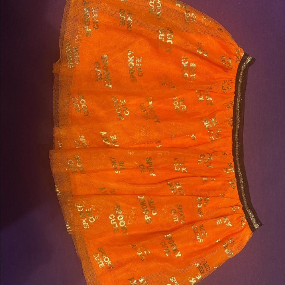 Vibrant Orange Skirt with Gold Accents